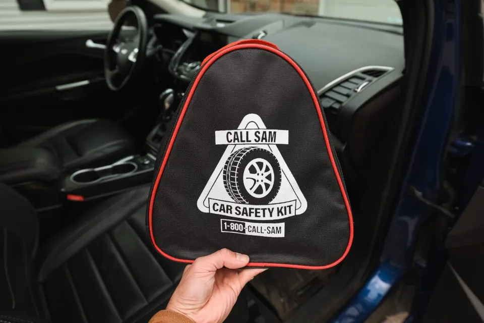 Call Sam Car Safety Kit relative size shown next to car interior