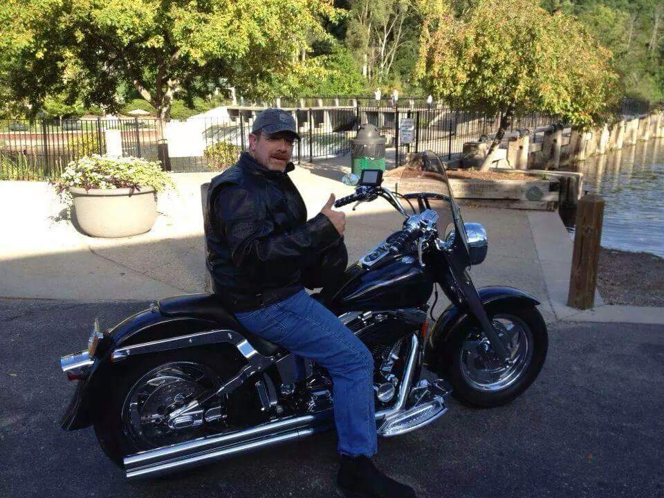 Attorney Stan Feldman on his Harley Davidson motorcycle
