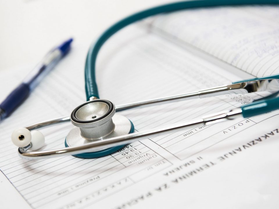 stethoscope on top of paperwork