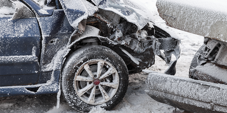 Two cars involved in a car accident during the winter
