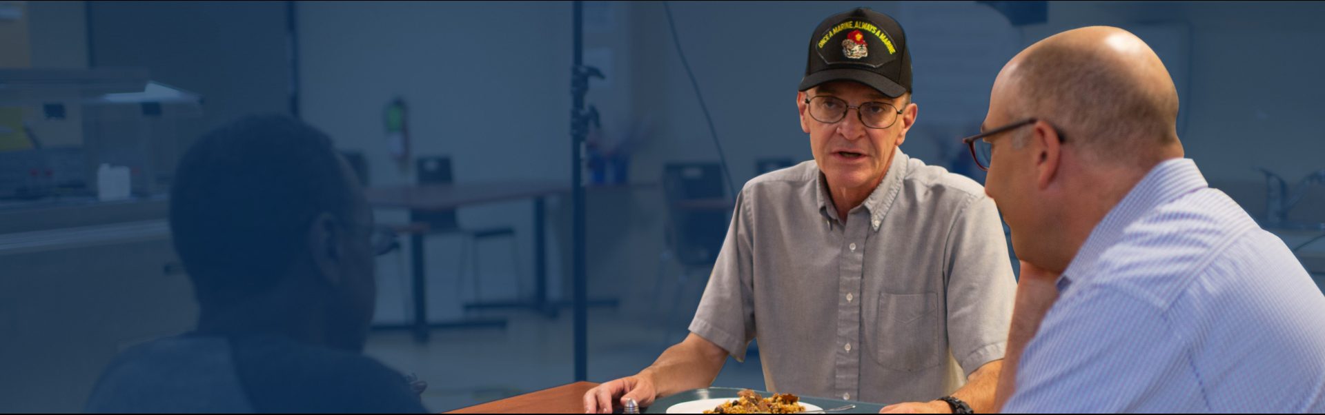 Mark Bernstein eating with a veteran