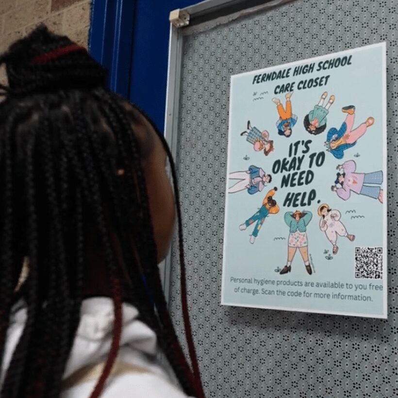 Girl looking at poster