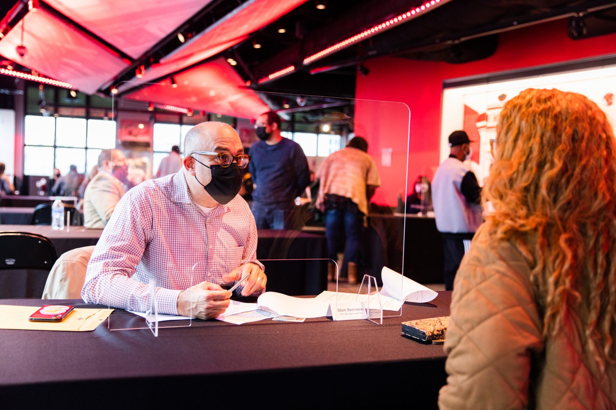 Mark Berstein talking to woman at event