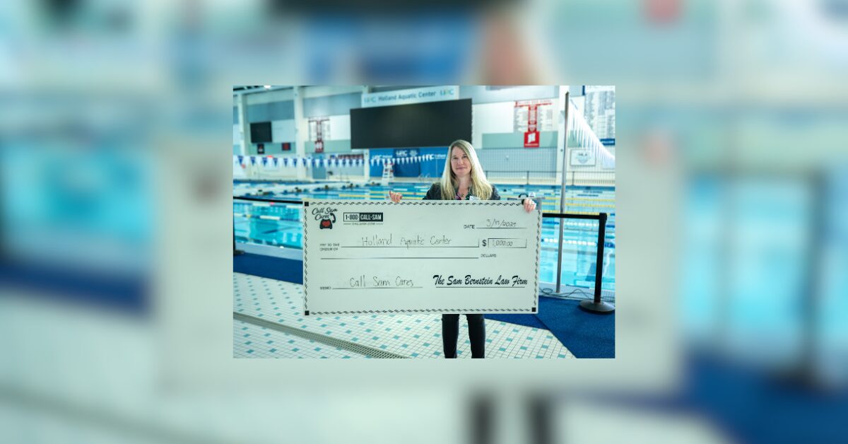 Woman holding large format check