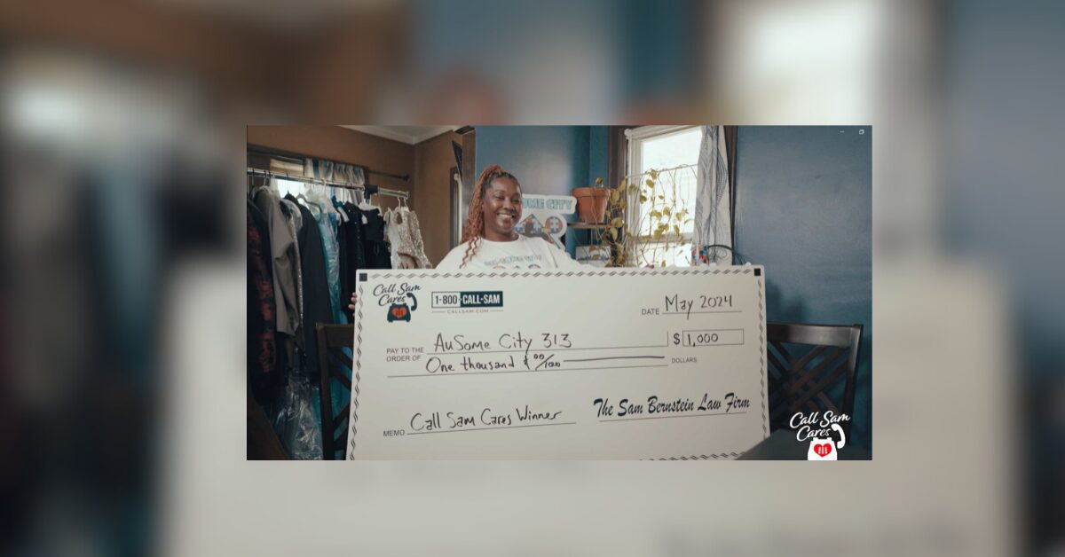 woman holding large format check