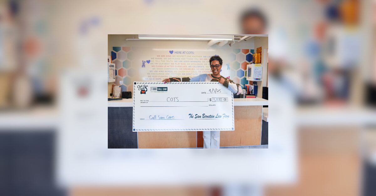 woman holding large format check