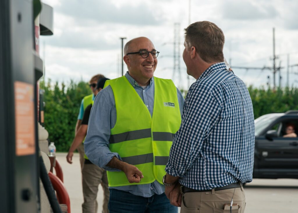 Mark Bernstein talking to customer at Gas Giveaway event