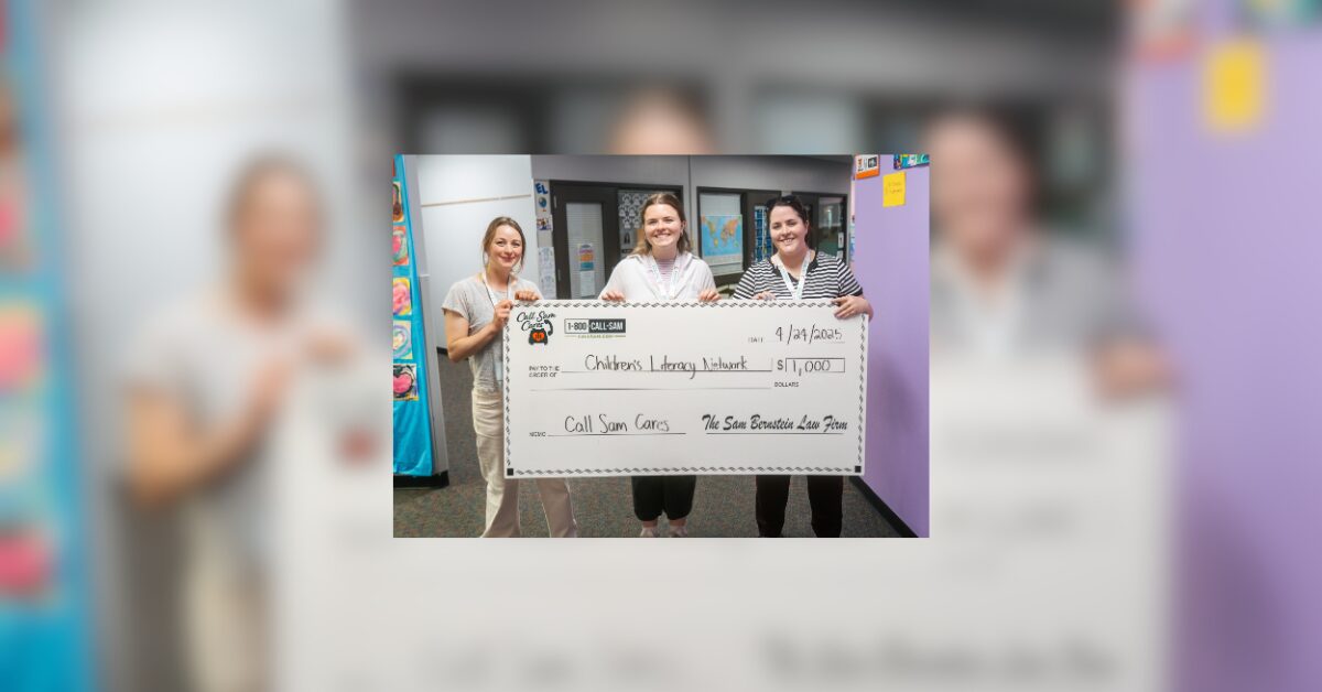 3 women holding large format check