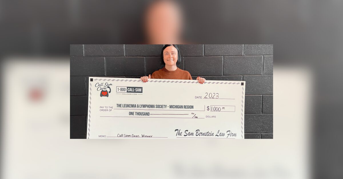 woman holding large format check